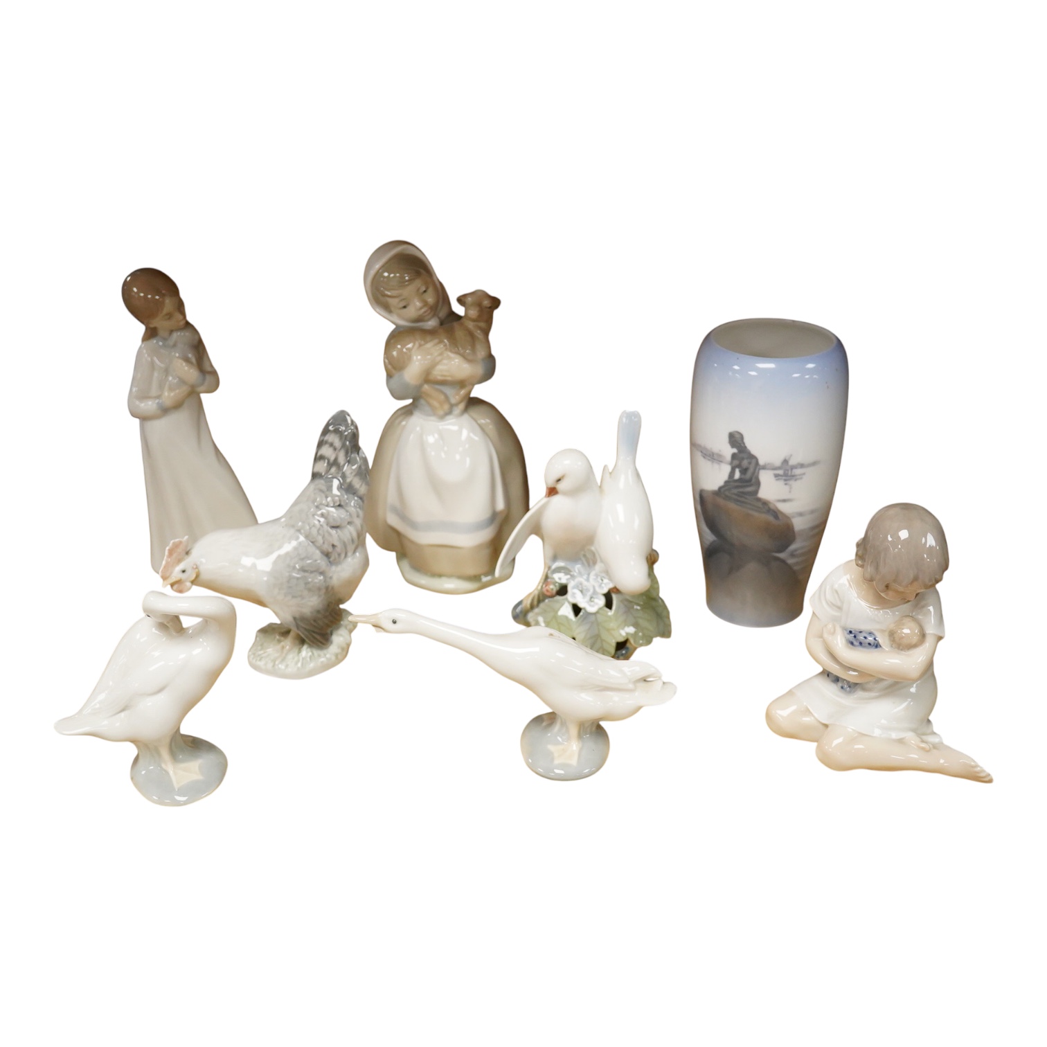 A group of Copenhagen, Nao and Lladro figures to include birds, together with a Royal Copenhagen vase, largest 21cm high